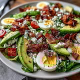 Spring Cobb Salad with Strawberries and Avocado - a colorful, fresh salad bursting with juicy berries, creamy avocado, crisp veggies, and tangy feta.