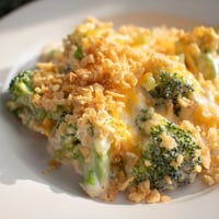 Steaming hot Broccoli Casserole with a bubbly cheese sauce and golden, buttery cracker topping.