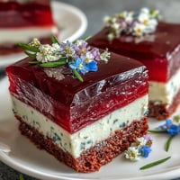 Vibrant agar-agar rainbow jelly cake with creamy coconut, perfect for summer parties.